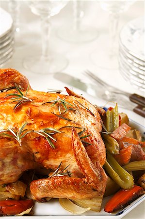 raw chicken dishes - Whole Roast Chicken with Rosemary and Roasted Vegetables Stock Photo - Premium Royalty-Free, Code: 659-03531593