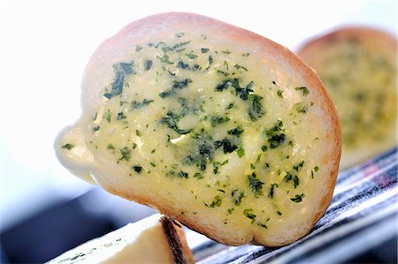 simsearch:659-03530038,k - Slice of baguette with herb butter Stock Photo - Premium Royalty-Free, Code: 659-03531681