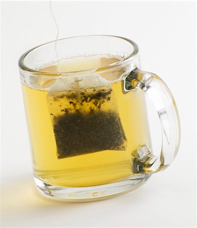 Glass Mug of Green Tea with Tea Bag Foto de stock - Sin royalties Premium, Código: 659-03531696