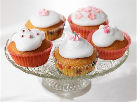 simsearch:659-03530847,k - Iced and decorated cupcakes on a cake stand Stock Photo - Premium Royalty-Free, Code: 659-03531886