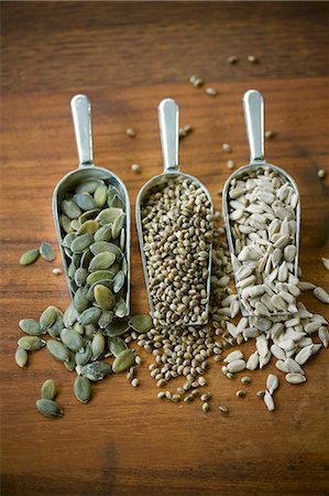 pumpkin seed - Pumpkin seeds, sesame seeds and hemp seeds in three scoops Stock Photo - Premium Royalty-Free, Code: 659-03532007