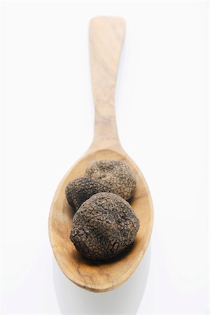 deli - Black truffles (Chinese truffles) on wooden spoon Stock Photo - Premium Royalty-Free, Code: 659-03532202