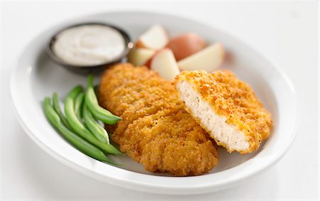 paniert - Breaded chicken breast Foto de stock - Sin royalties Premium, Código: 659-03532275