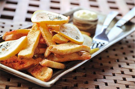 potato wedge - Country potatoes with lemon slices Stock Photo - Premium Royalty-Free, Code: 659-03532466