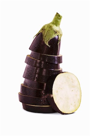 Sliced and Stacked Eggplant on White Background Stock Photo - Premium Royalty-Free, Code: 659-03532470