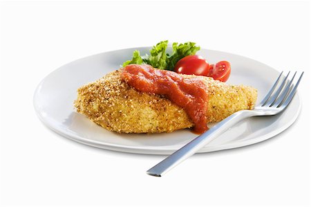 simsearch:659-03528591,k - Breaded Baked Chicken Breast with Tomato Sauce Stock Photo - Premium Royalty-Free, Code: 659-03532497