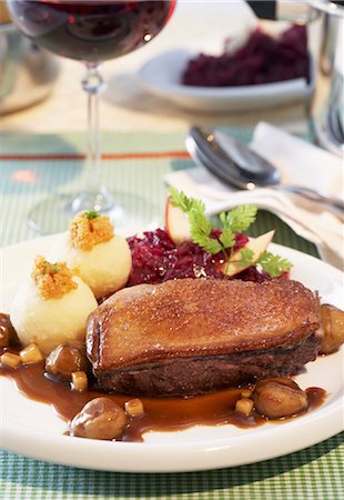 Duck breast with chestnuts, potato dumplings and red cabbage Stock Photo - Premium Royalty-Free, Code: 659-03532569