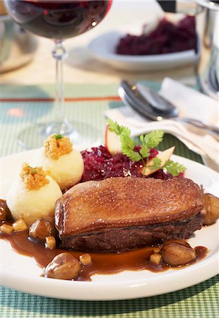 duck not waterfowl - Duck breast with chestnuts, potato dumplings and red cabbage Stock Photo - Premium Royalty-Free, Code: 659-03532569