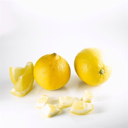 simsearch:659-03533985,k - Two lemons and pieces of lemon Stock Photo - Premium Royalty-Free, Code: 659-03532961