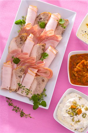 sausage still life - Cold cut platter with three different dips Stock Photo - Premium Royalty-Free, Code: 659-03533112