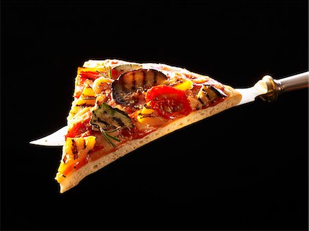 pizza on black - A slice of grilled vegetable pizza on knife Stock Photo - Premium Royalty-Free, Code: 659-03533324