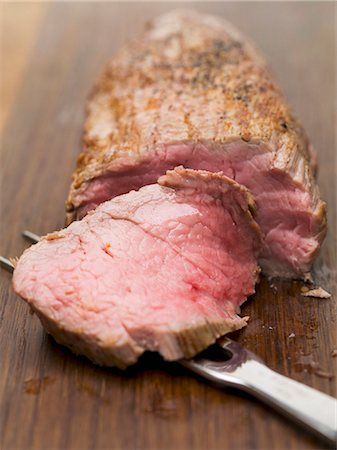 fillet beef recipes - Roast veal fillet, partially carved Stock Photo - Premium Royalty-Free, Code: 659-03533396
