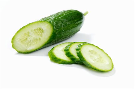 A piece of cucumber and cucumber slices Stock Photo - Premium Royalty-Free, Code: 659-03533467