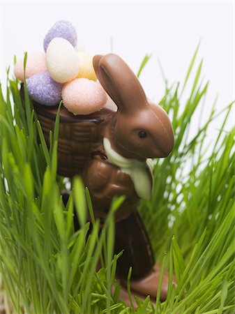 Chocolate Easter Bunny with sugar eggs in grass Stock Photo - Premium Royalty-Free, Code: 659-03533603