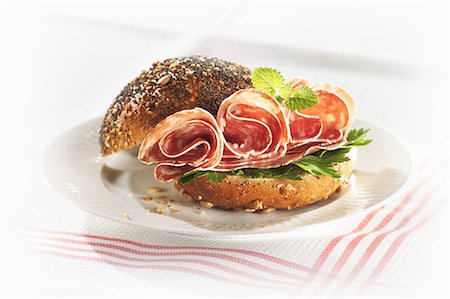 sausage, bun - Salami in poppy seed roll Stock Photo - Premium Royalty-Free, Code: 659-03533636
