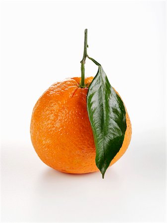 An orange with leaf Stock Photo - Premium Royalty-Free, Code: 659-03533702