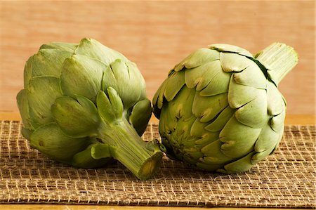 Two Whole Artichokes Stock Photo - Premium Royalty-Free, Code: 659-03533756