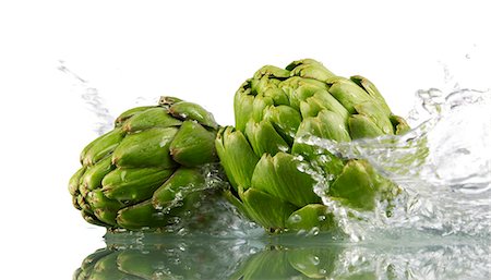 Two artichokes with splashing water Foto de stock - Sin royalties Premium, Código: 659-03533783