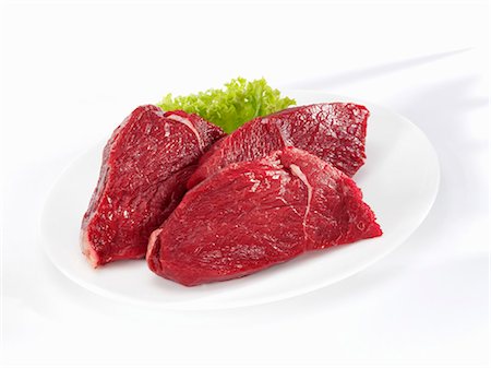 Bison steaks (rump) Foto de stock - Sin royalties Premium, Código: 659-03533964