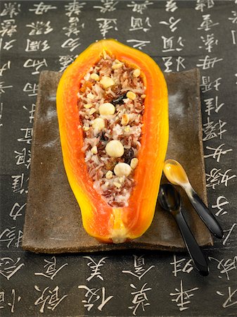 simsearch:652-03803518,k - Half a papaya stuffed with wild rice Stock Photo - Premium Royalty-Free, Code: 652-05806910