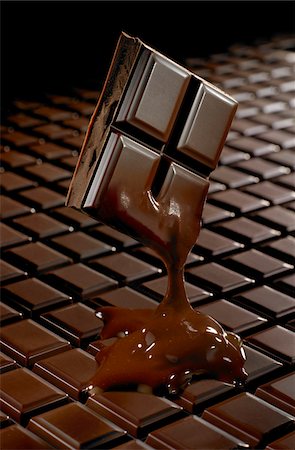 square chocolate - Piece of melting dark chocolate Stock Photo - Premium Royalty-Free, Code: 652-05806988