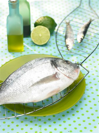 simsearch:652-07655096,k - Raw sea bream to be grilled Stock Photo - Premium Royalty-Free, Code: 652-05807653