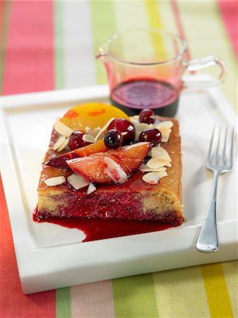 simsearch:652-05809042,k - Portion of plum,almond and cherry tart with hibiscus syrup Stock Photo - Premium Royalty-Free, Code: 652-05807853