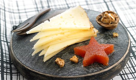 Manchego cheese,walnut and star-shaped fruit paste Stock Photo - Premium Royalty-Free, Code: 652-05808022