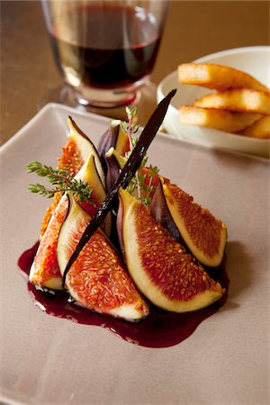 Fresh fig pyramid with summer fruit puree,thyme and vanilla Stock Photo - Premium Royalty-Free, Code: 652-05808249