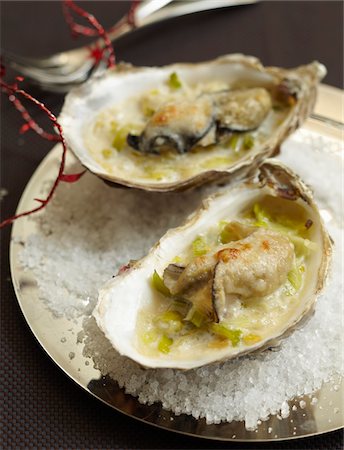 Grilled oysters with soft leeks and parmesan Stock Photo - Premium Royalty-Free, Code: 652-05808490