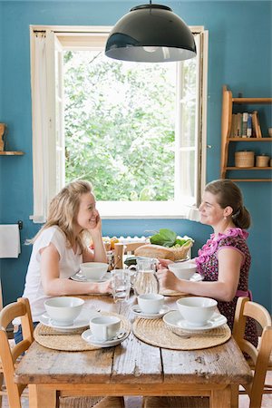 Women sitting down at the lunch table Stock Photo - Premium Royalty-Free, Code: 652-05808584