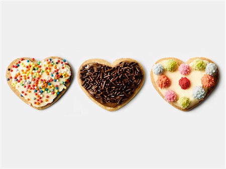 expreso (correo) - Row of heart-shaped decorated cookies Foto de stock - Sin royalties Premium, Código: 652-05808846
