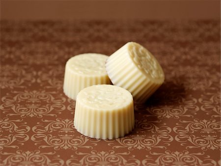 simsearch:652-05808884,k - Three white chocolates Stock Photo - Premium Royalty-Free, Code: 652-05808895