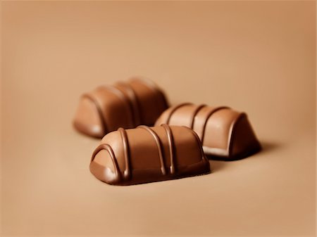Three chocolates Stock Photo - Premium Royalty-Free, Code: 652-05808890