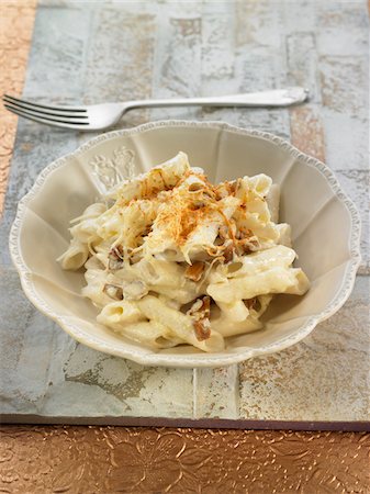 short pasta - Rice macaronis with mushrooms and almonds Stock Photo - Premium Royalty-Free, Code: 652-05809035