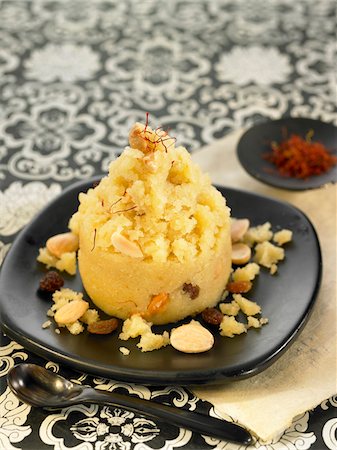 Semolina with butter,saffron,almonds and raisins Stock Photo - Premium Royalty-Free, Code: 652-05809215