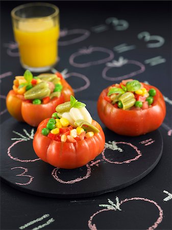 simsearch:652-05807822,k - Raw tomatoes stuffed with peas,red peppers and sweet corn Foto de stock - Sin royalties Premium, Código: 652-05809245