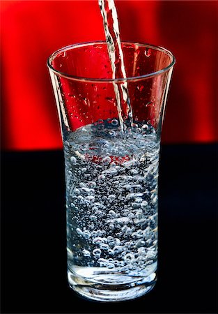 füllung - Pouring a glass of water Stock Photo - Premium Royalty-Free, Code: 652-05809370