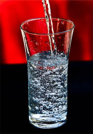 pouring water into glass - Pouring a glass of water Stock Photo - Premium Royalty-Free, Code: 652-05809370