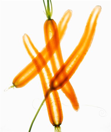 simsearch:652-05807656,k - Thinly sliced whole carrots on a white background Foto de stock - Sin royalties Premium, Código: 652-05809524