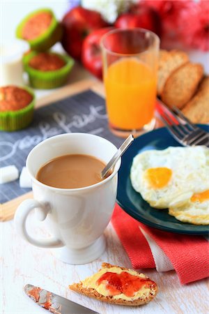 simsearch:652-05808282,k - Breakfast with fried eggs,Krisprolls and muffins Stock Photo - Premium Royalty-Free, Code: 652-05809627