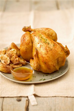 roast (cut of meat) - Roast chicken ,potatoes and gravy Stock Photo - Premium Royalty-Free, Code: 652-05809668