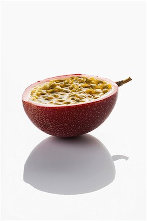 simsearch:652-07656119,k - Half a passionfruit Stock Photo - Premium Royalty-Free, Code: 652-06818633