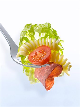 fusilli - Fusilli,tomato,raw beef and lettuce on a fork Stock Photo - Premium Royalty-Free, Code: 652-06818657