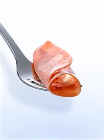 presunto - Boiled ham on a fork Foto de stock - Royalty Free Premium, Número: 652-06818664