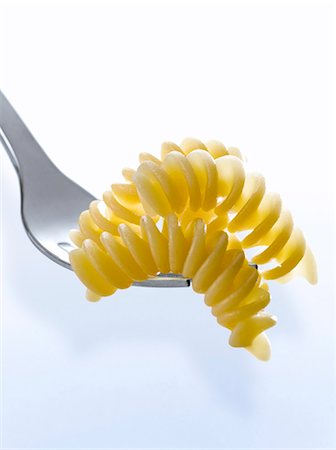 Fusilli on a fork Stock Photo - Premium Royalty-Free, Code: 652-06818662