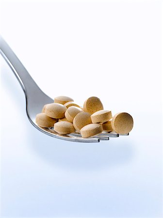 food supplement - Pills on a fork Stock Photo - Premium Royalty-Free, Code: 652-06818663