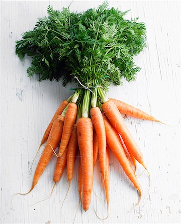 Bunch of carrots with their tops Stock Photo - Premium Royalty-Free, Code: 652-06818759