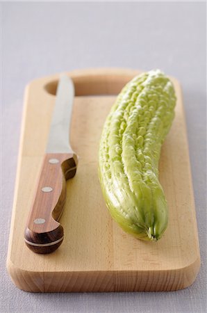 simsearch:652-07655523,k - Bitter cucumber on a cutting board Foto de stock - Sin royalties Premium, Código: 652-06818877