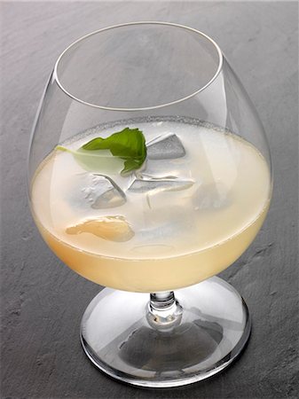 Flower power cocktail made with pear Eau-de-vie,grapefruit juice and orange blossom Stock Photo - Premium Royalty-Free, Code: 652-06818907